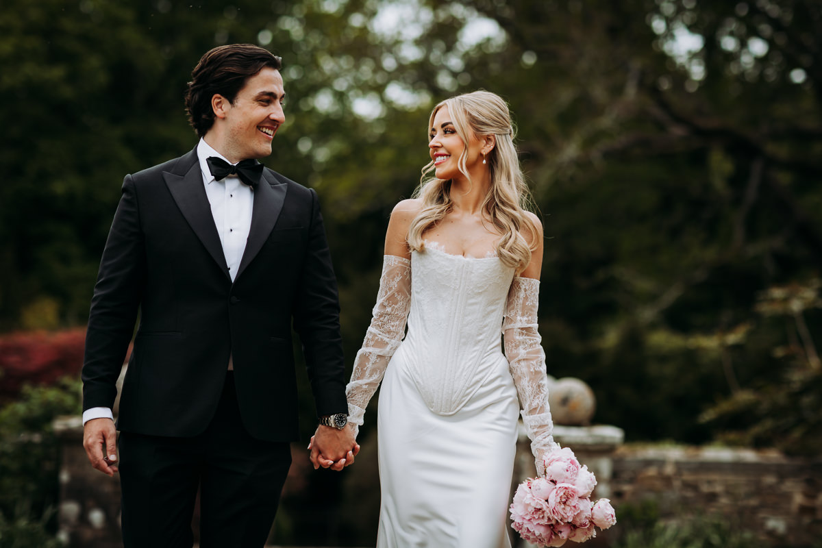 Beautiful Bride & Groom holding hands at DIY wedding